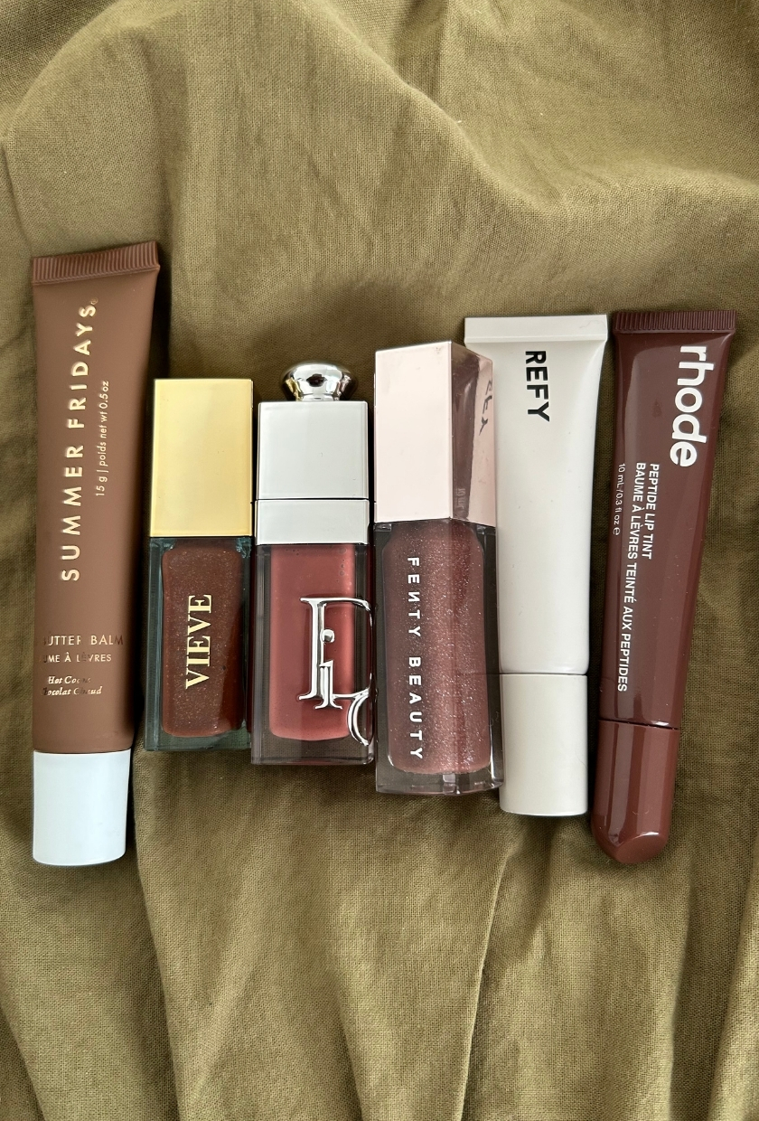 Summer Fridays lip balm in Hot Cocoa, Vieve Lip Dew in Supermodel, Dior lip oil in Latte, Fenty Gloss Bomb in Hot Chocolit, Refy lip gloss in Suede, Rhode lip tint in Espresso