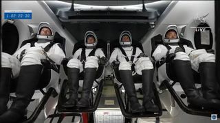 NASA's Crew-2 astronauts are seen aboard their SpaceX Crew Dragon Endeavour after boarding the craft for a launch to the International Space Station from Pad 39A of NASA's Kennedy Space Center in Cape Canaveral, Florida on April 23, 2021.