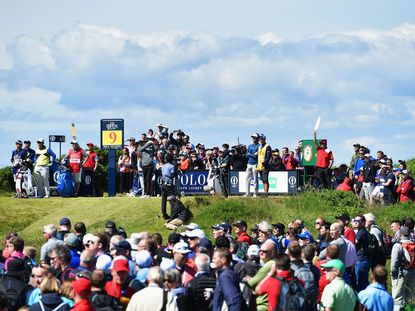 Open crowds following Rory