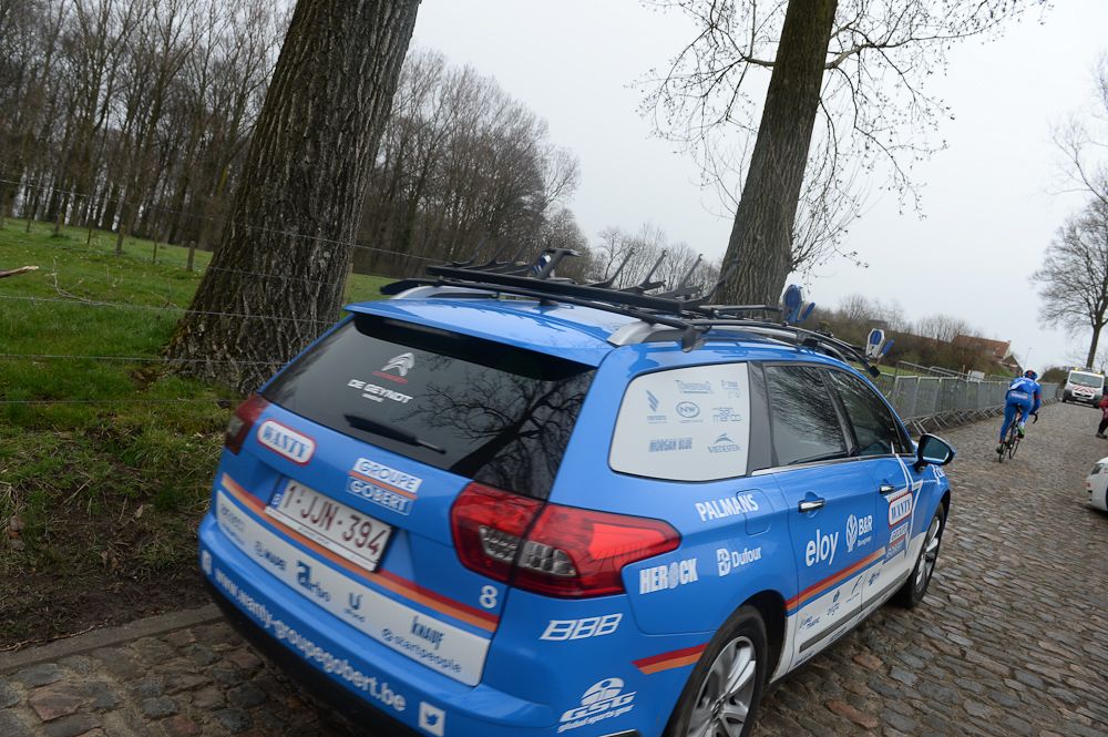 The Wanty-Groupe Gobert team car handles the cobbles.