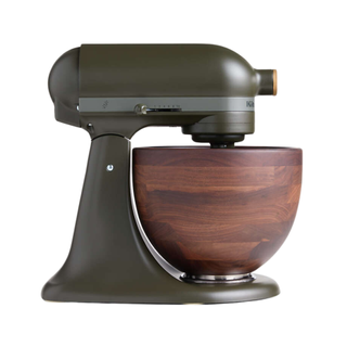 A dark green stand mixer with wooden bowl 