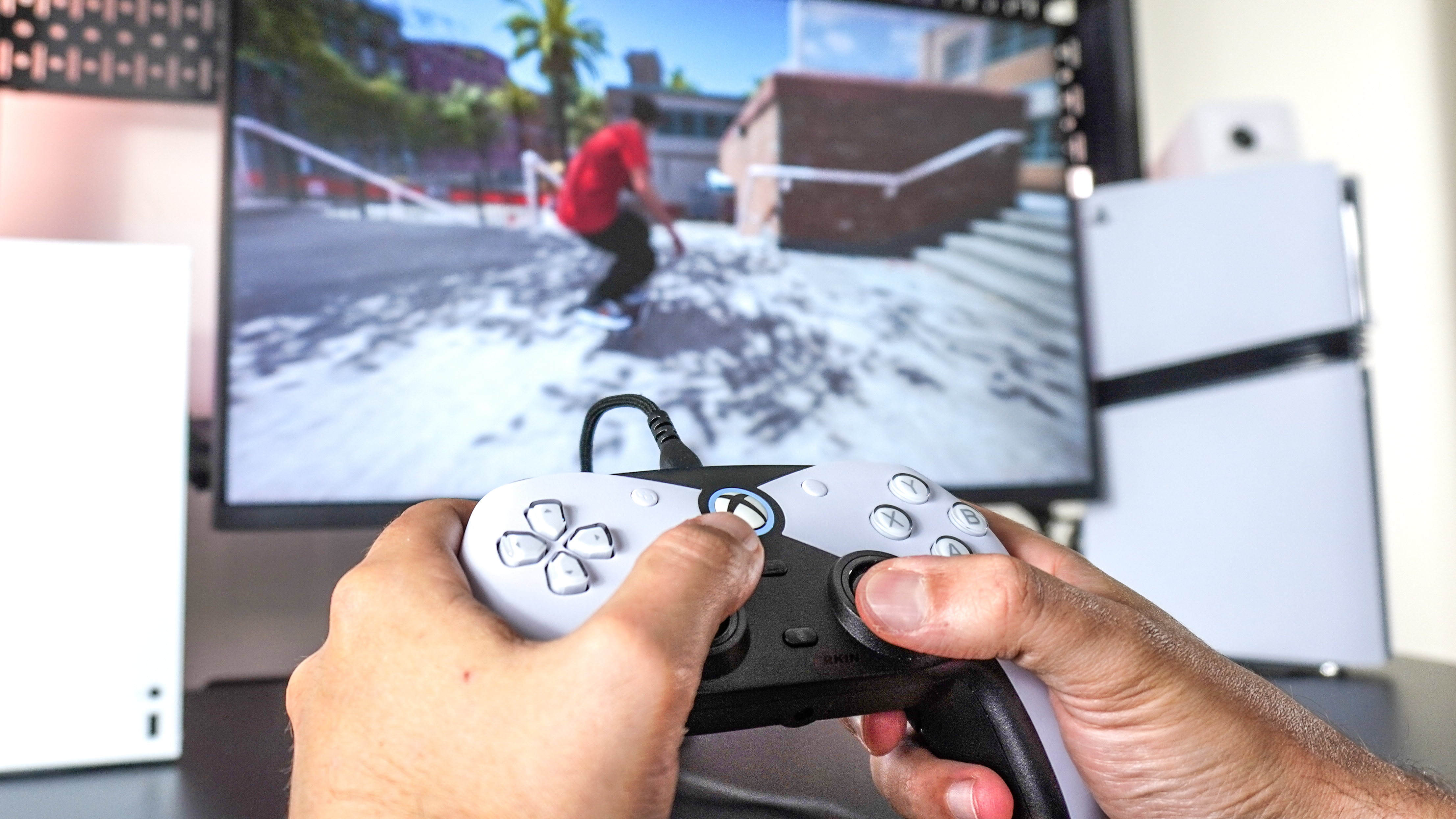 A person playing the skateboarding sim Session on Xbox using the Hyperkin Competitor controller