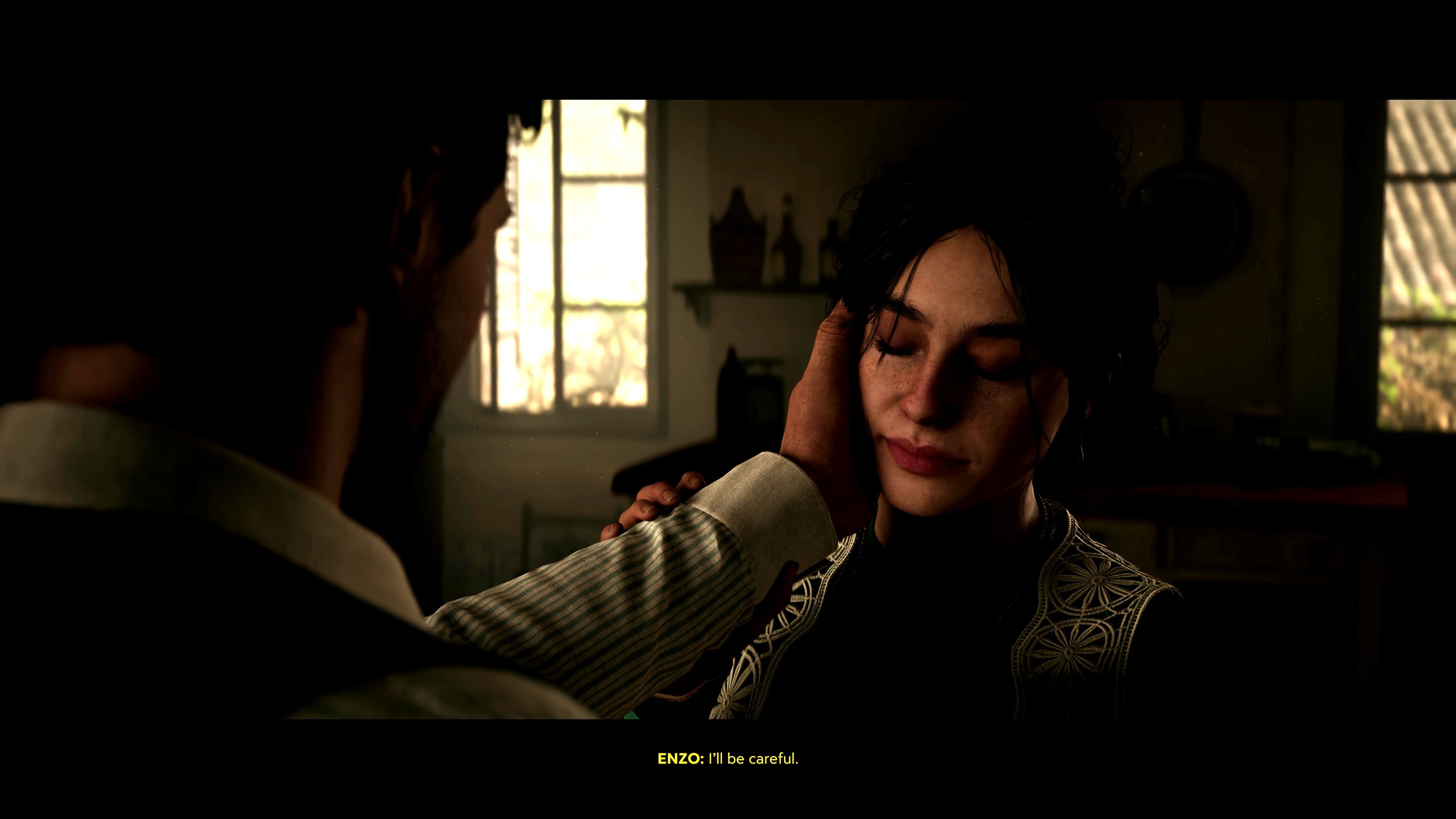 Enzo touches Isabella's face tenderly.