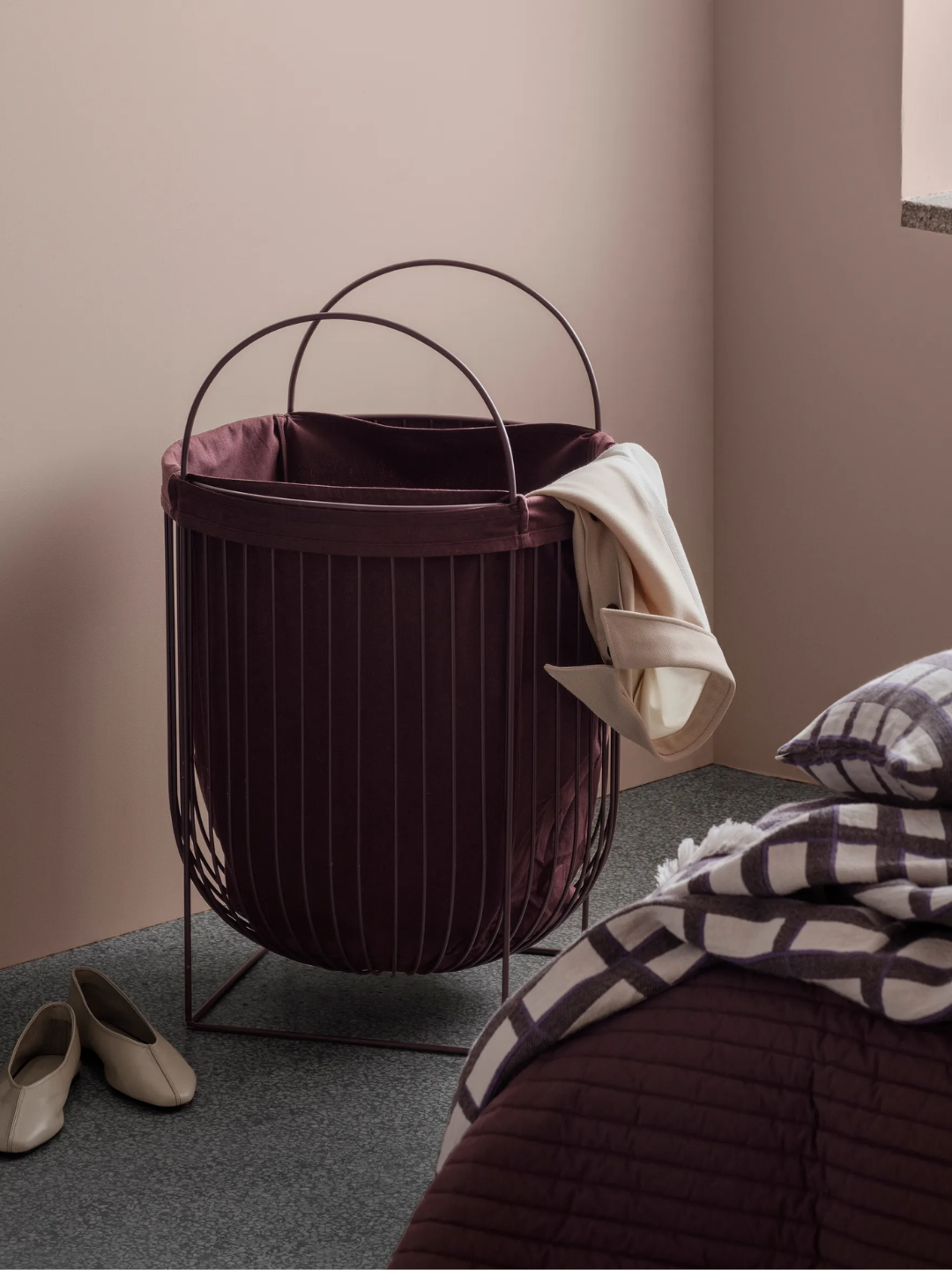 A deep purple laundry bin from Broste Copenhagen