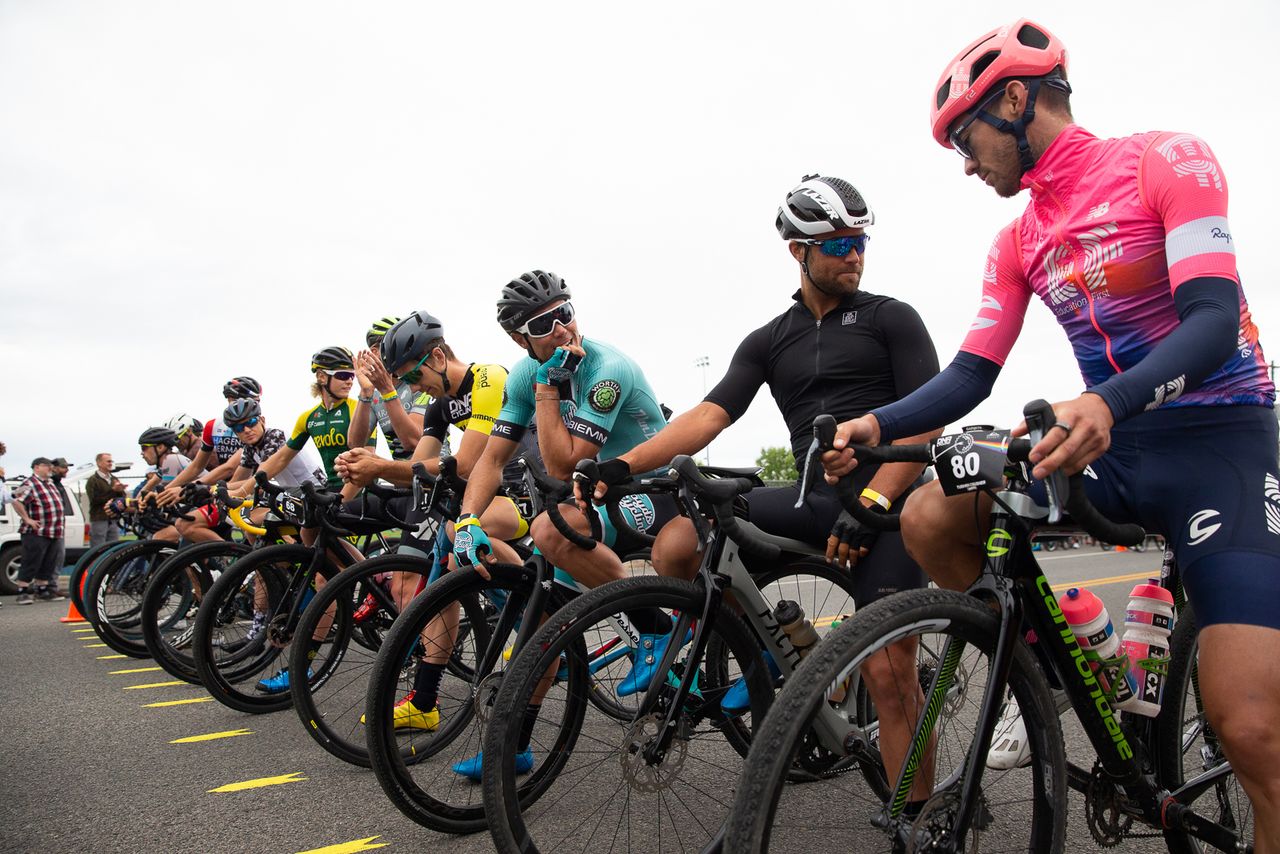 A stacked Pro Men's field. 2019 National Criterium Champion Travis McCabe and National Road Champion Alex Howes chats at the start line with former National Road Champion Eric Marcott.