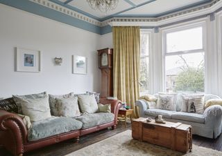 living room with sofa and windows