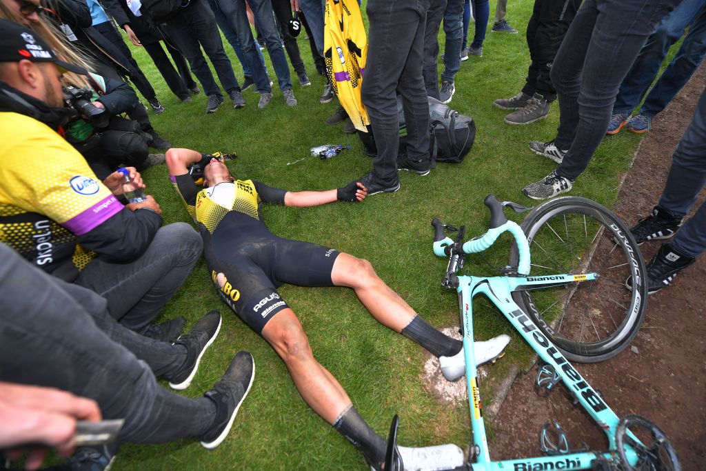 Wout Van Aert collapses, shattered, after his day-long efforts