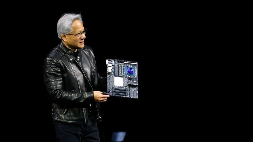 Nvidia CEO Jensen Huang holding a blackwell ultra chip