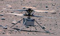 closeup of a small helicopter on a rocky, red-dirt landscape