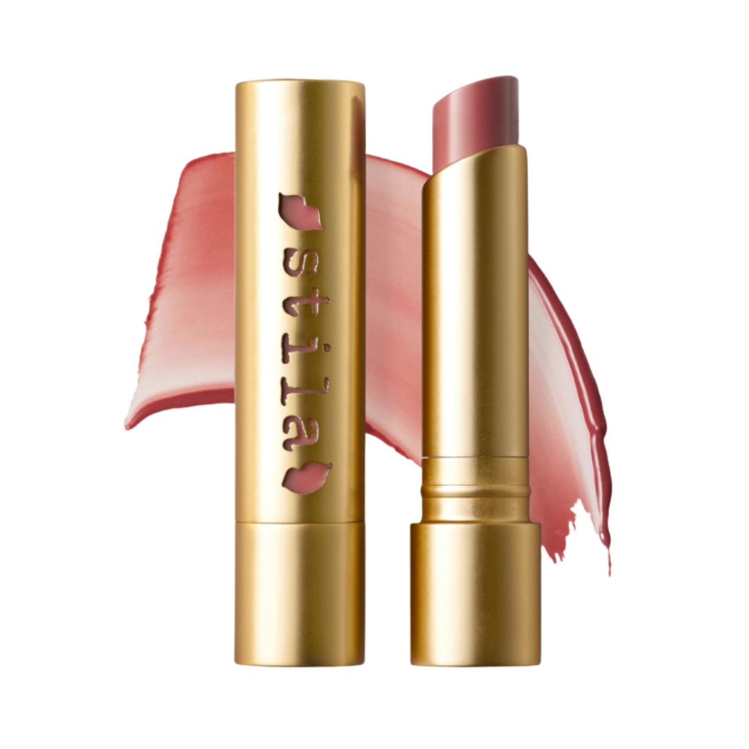A product shot of the Stila Heaven's Dew Honey Glow Balm alongside a swatch of the shade on a white background