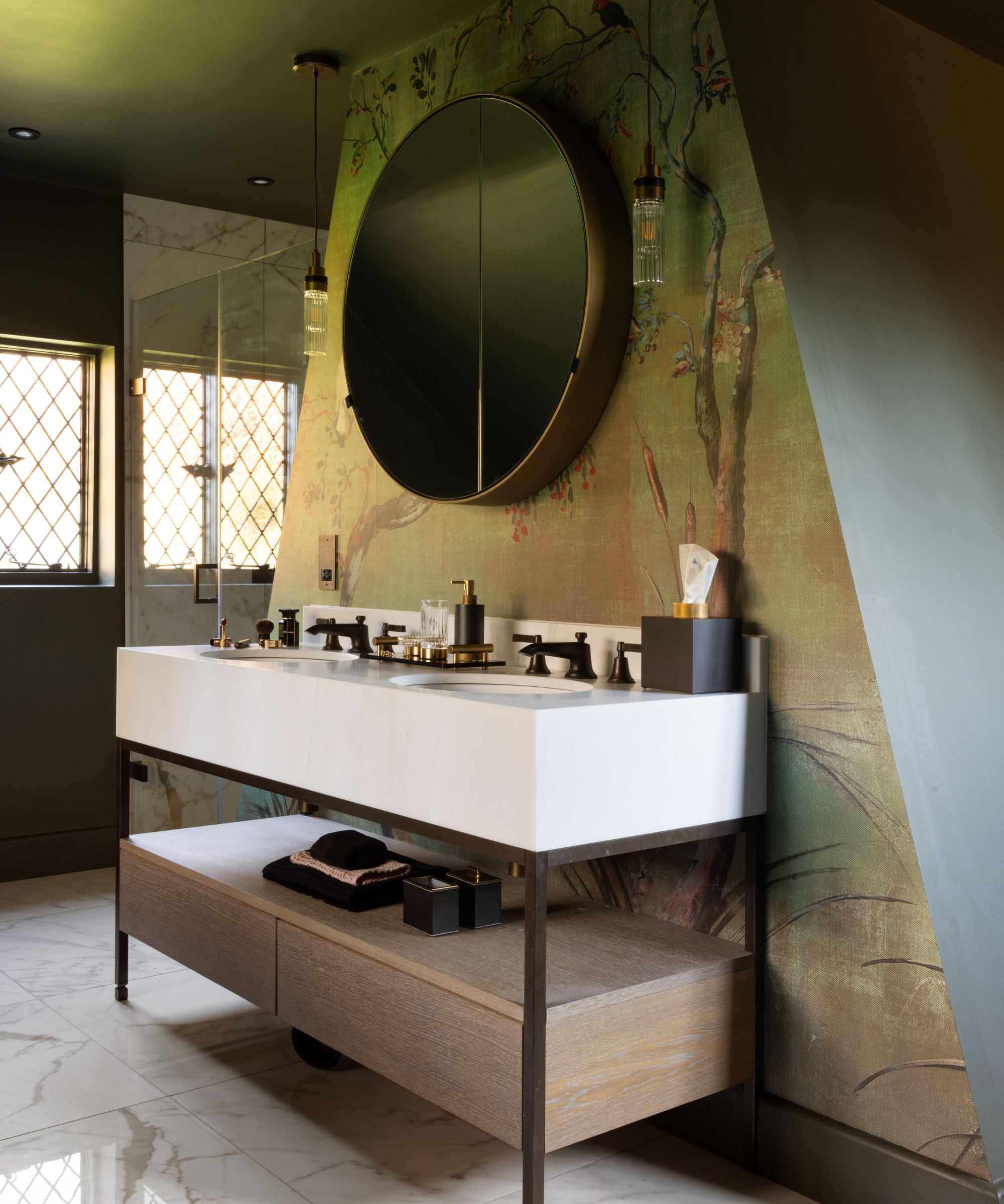 A modern bathroom vanity paired with a more traditional wallpaper