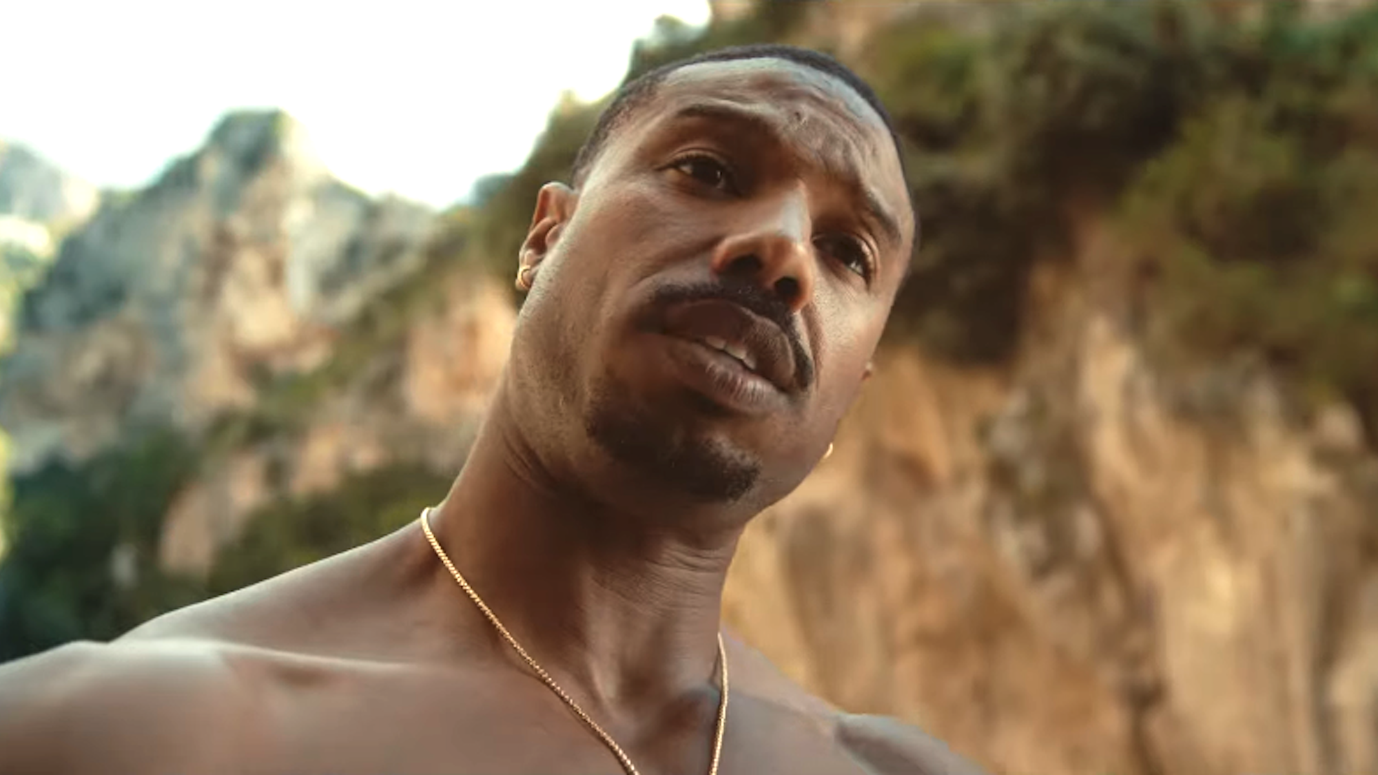 Michael B. Jordan on a beach in The Thomas Crown Affair 