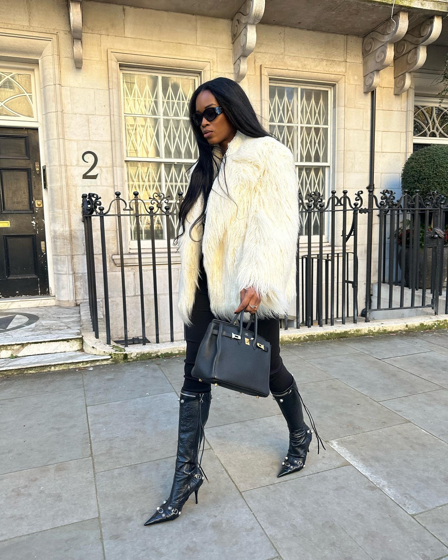 Fashion person Marylin wears a faux fur jacket outfit.