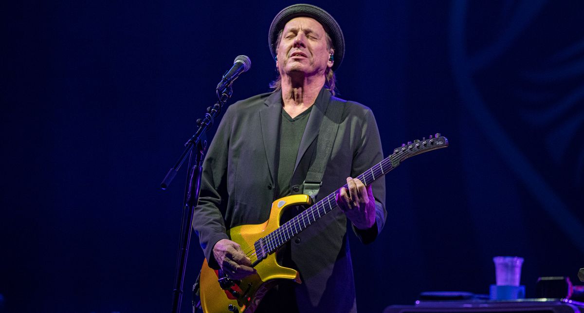 Adrian Belew plays a gold metallic Parker Fly electric guitar as he performs onstage with Beat, the prog supergroup featuring Steve Vai and performing &#039;80s King Crimson material.