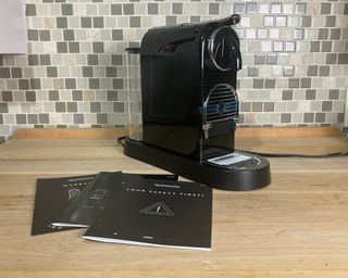 Nespresso Citiz espresso maker in Limousine Black with instruction manual and other literature