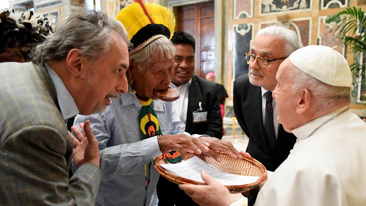 Pope Francis meets attendees at the Vatican summit on the climate crisis