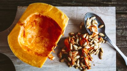 pumpkin seeds next to pumpkin