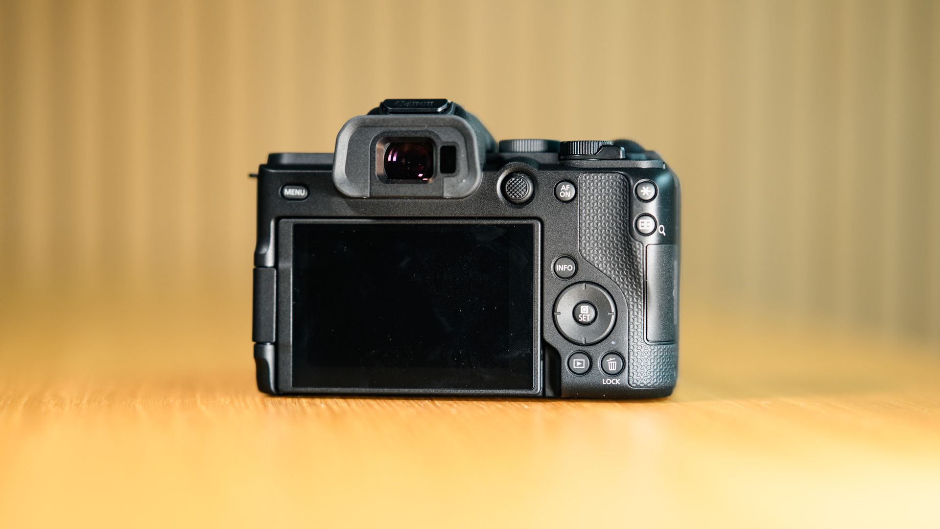 Rear of the Canon EOS R8 Mark II on a wooden table