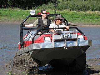"Meteorite Men" Geoff Notkin and Steve Arnold navigate around in an amphibious vehicle. The guys affectionately call their go-anywhere Hydratrek "The Rockhound," and it really does go anywhere.
