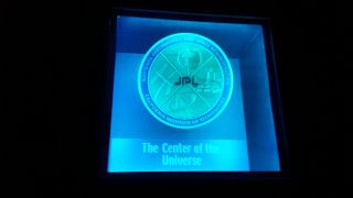 A plaque marks the "Center of the Universe," the nickname for the Deep Space Network command center.
