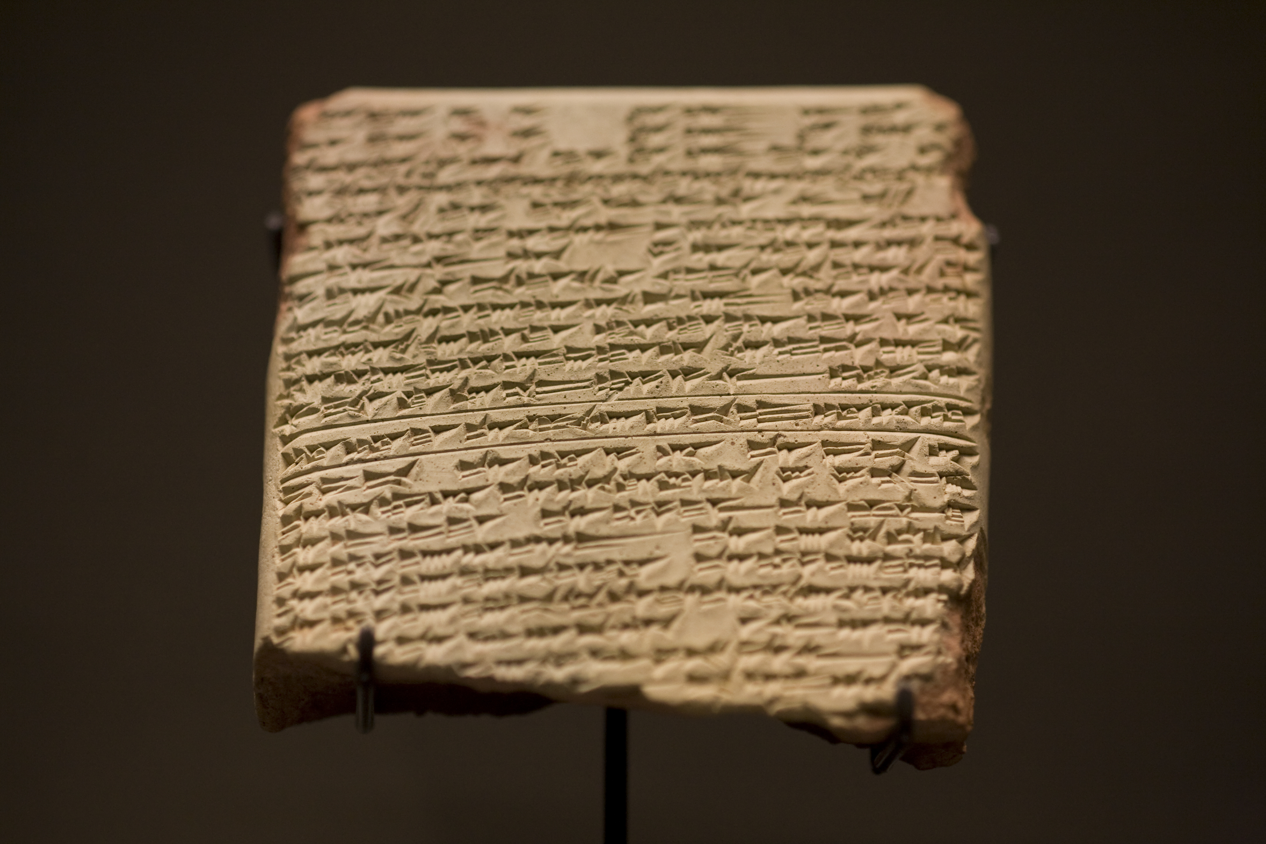 Ancient cuneiform script on a clay tablet.