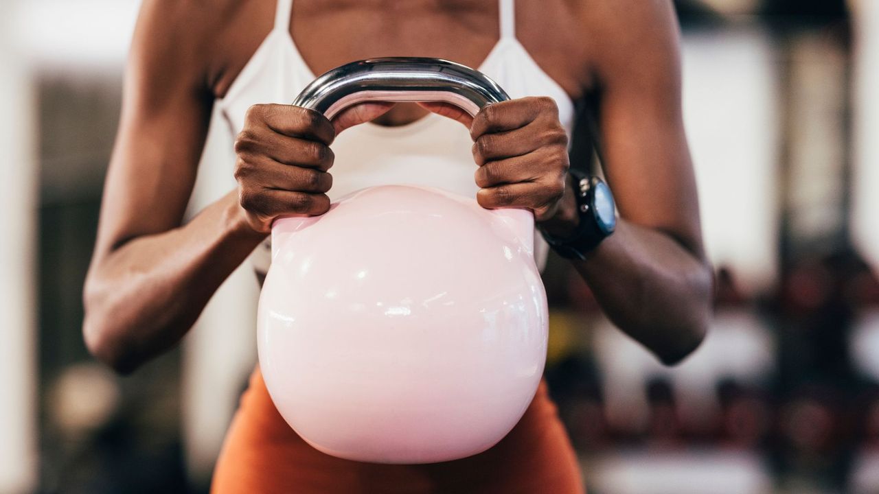 A young lady doing a beginners strength training workout for women