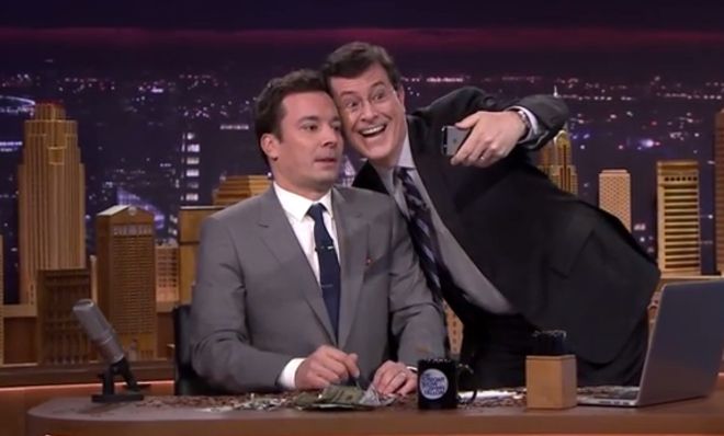 Stephen Colbert showers Jimmy Fallon