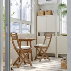 IKEA ASKHOLMEN wooden dining table and chairs set in a small flat