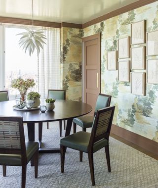 dining room with round table and abstract wallpaper