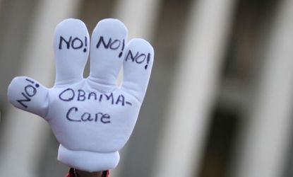 Demonstrators protest against President Obama's health care reform law: A new poll suggests two-thirds of Americans want all or part of the law overturned.
