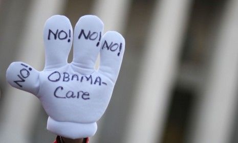 Demonstrators protest against President Obama&amp;#039;s health care reform law: A new poll suggests two-thirds of Americans want all or part of the law overturned.