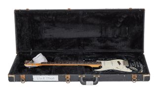 A Stratocaster that was played (and smashed) by Nirvana's Kurt Cobain sits in its original case