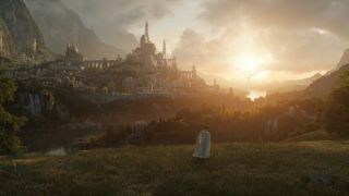 A mysterious figure stands off in the distance in a still image from Amazon's Lord of the Rings series