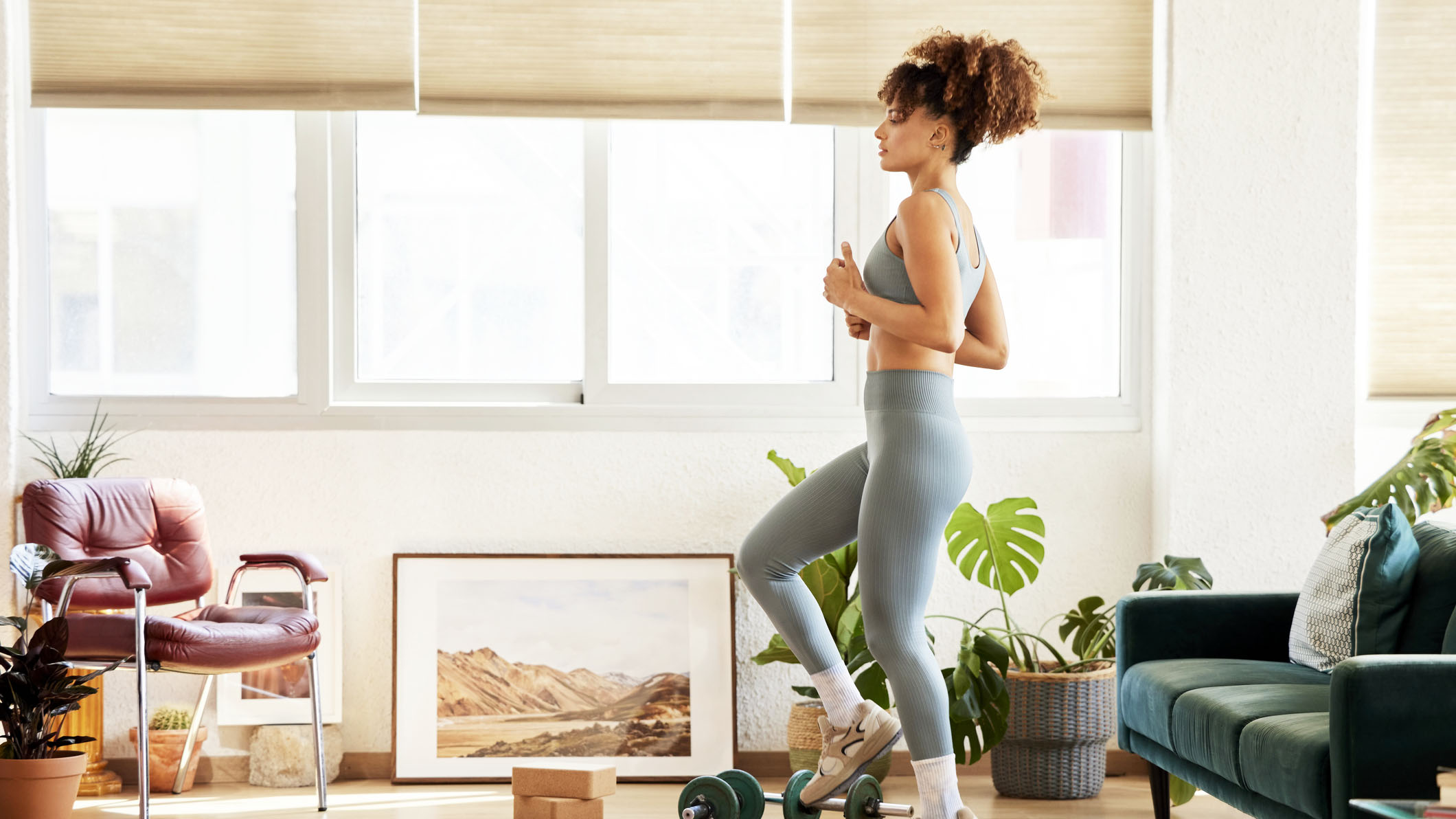 a photo of a woman doing a walking workout at home
