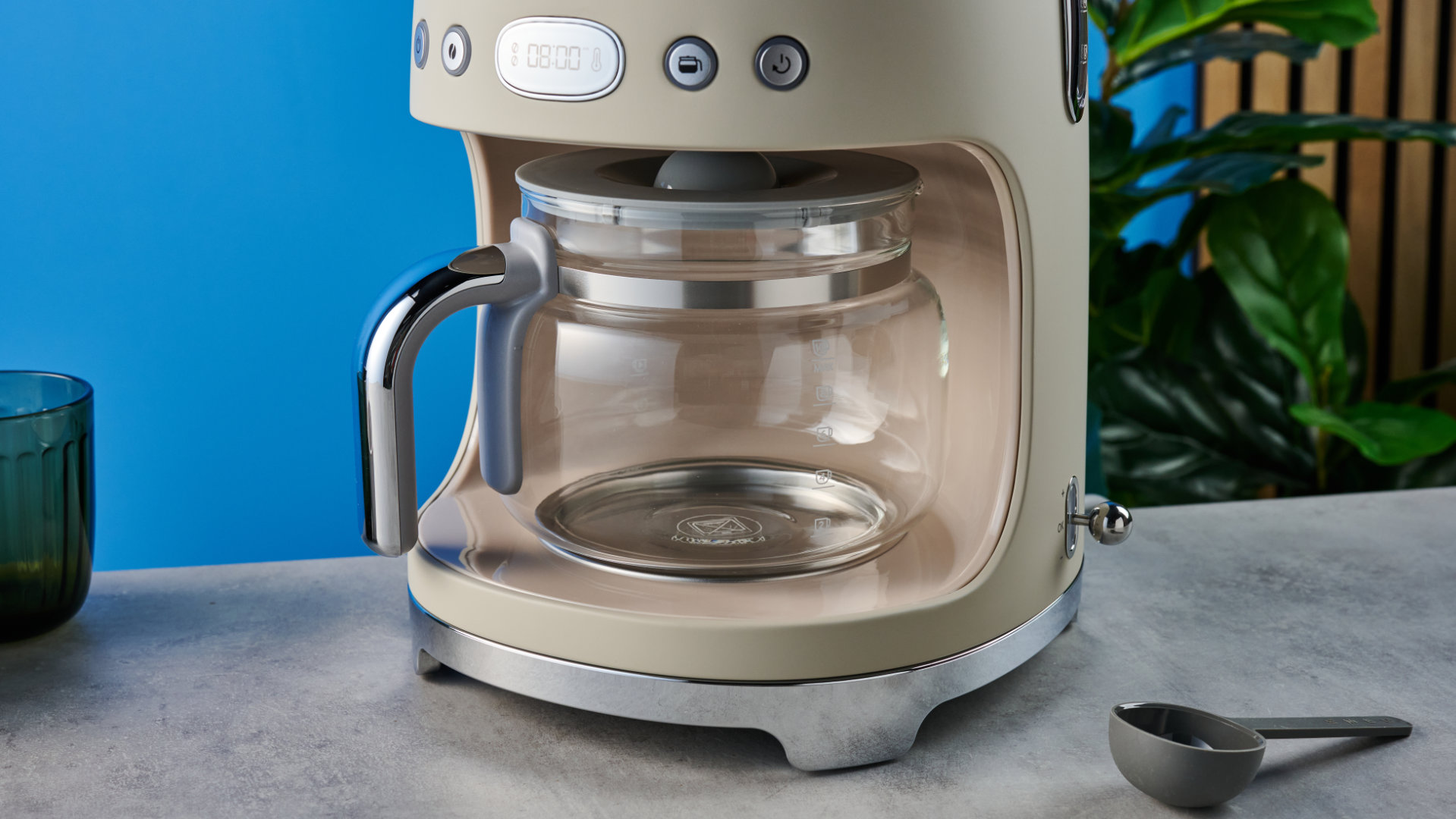 the smeg retro coffee maker photographed against the blue tom's guide background