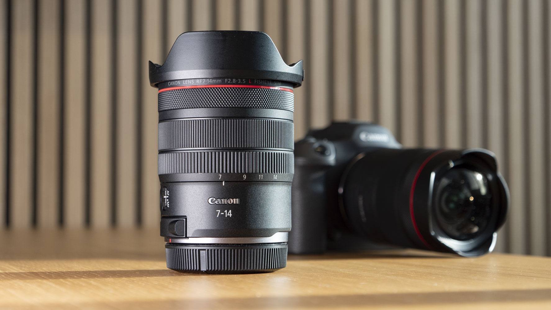 Canon RF 7-14mm F2.8-3.5L Fisheye STM lens on a wooden surface