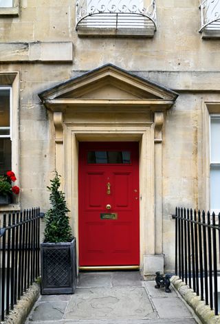 red front door on grand house