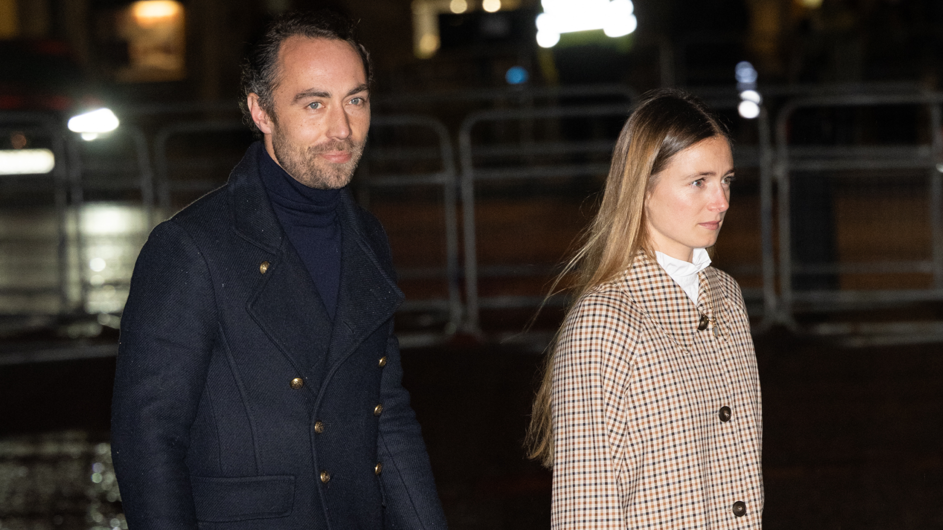 James Middleton wearing a blue coat next to Alizee Thevenet in a plaid suit