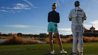 Nelly Korda in shorts that would be above the knee on a woman who was 5' tall