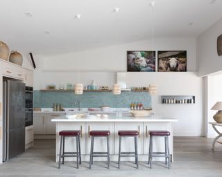 White country kitchen with island in luxurious Cotswolds barn