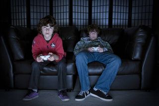 Two boys playing video games.