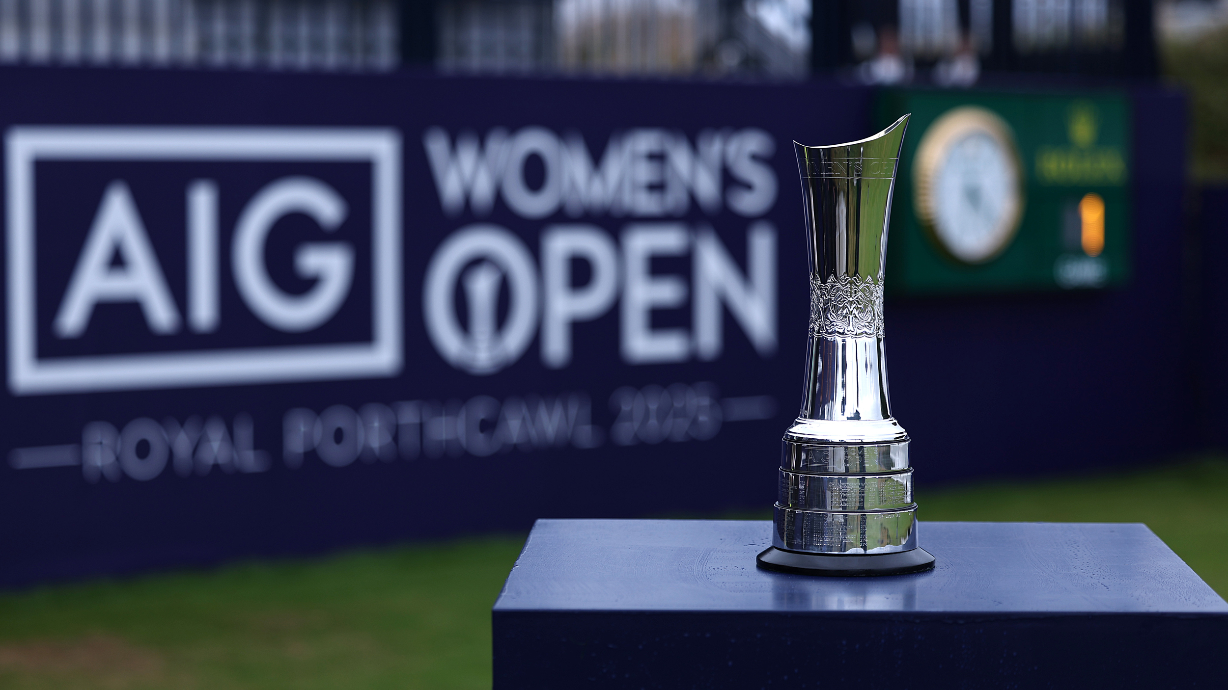 The AIG Women&#039;s Open trophy in front of AIG Women&#039;s Open signage on the 1st tee