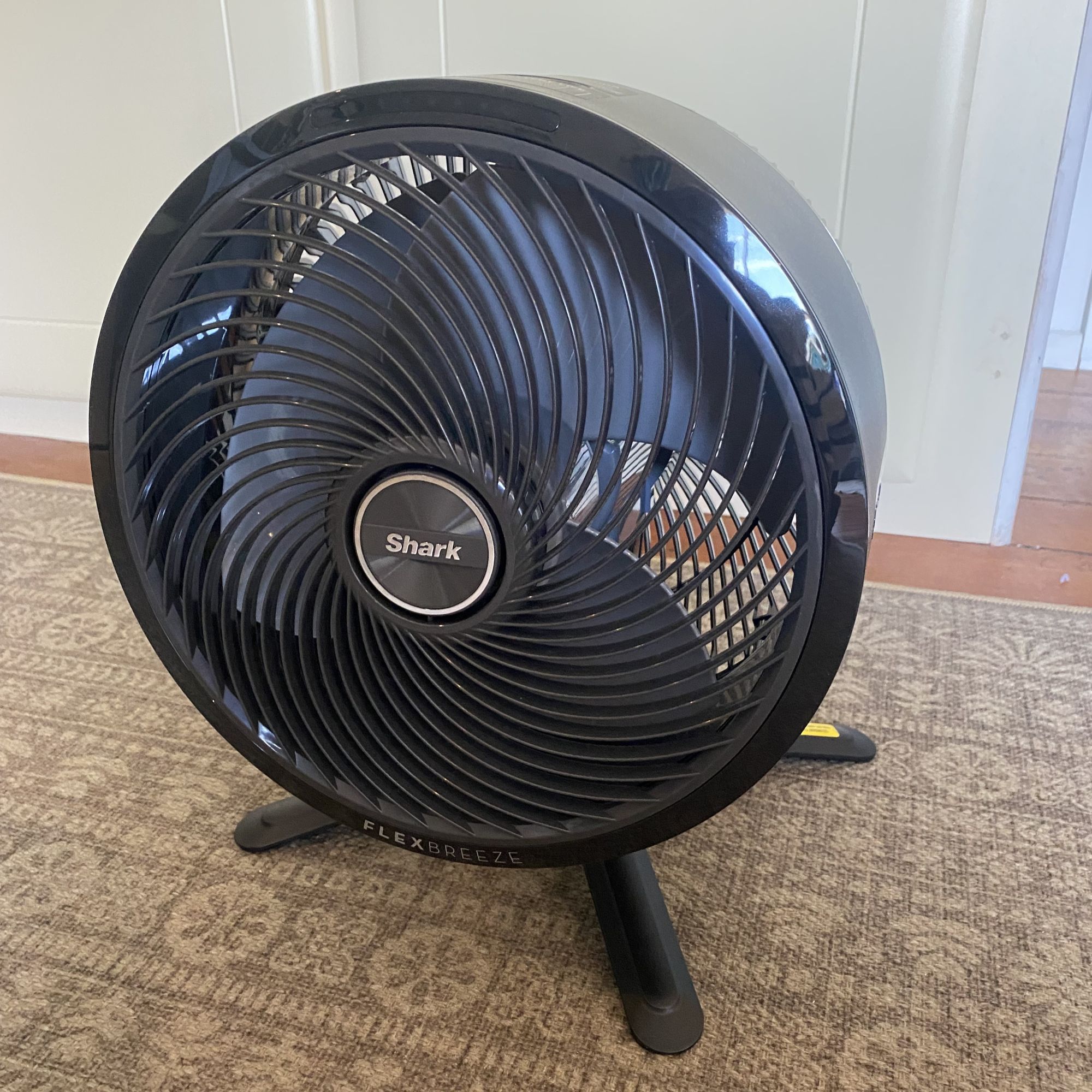 Shark Flexbreeze portable fan in desktop mode on a patterned rug