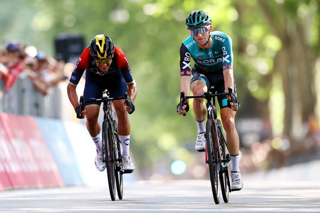 TURIN ITALY MAY 21 LR Richard Carapaz of Ecuador and Team INEOS Grenadiers and Jai Hindley of Australia and Team Bora Hansgrohe cross the finish line during the 105th Giro dItalia 2022 Stage 14 a 147km stage from Santena to Torino Giro WorldTour on May 21 2022 in Turin Italy Photo by Michael SteeleGetty Images
