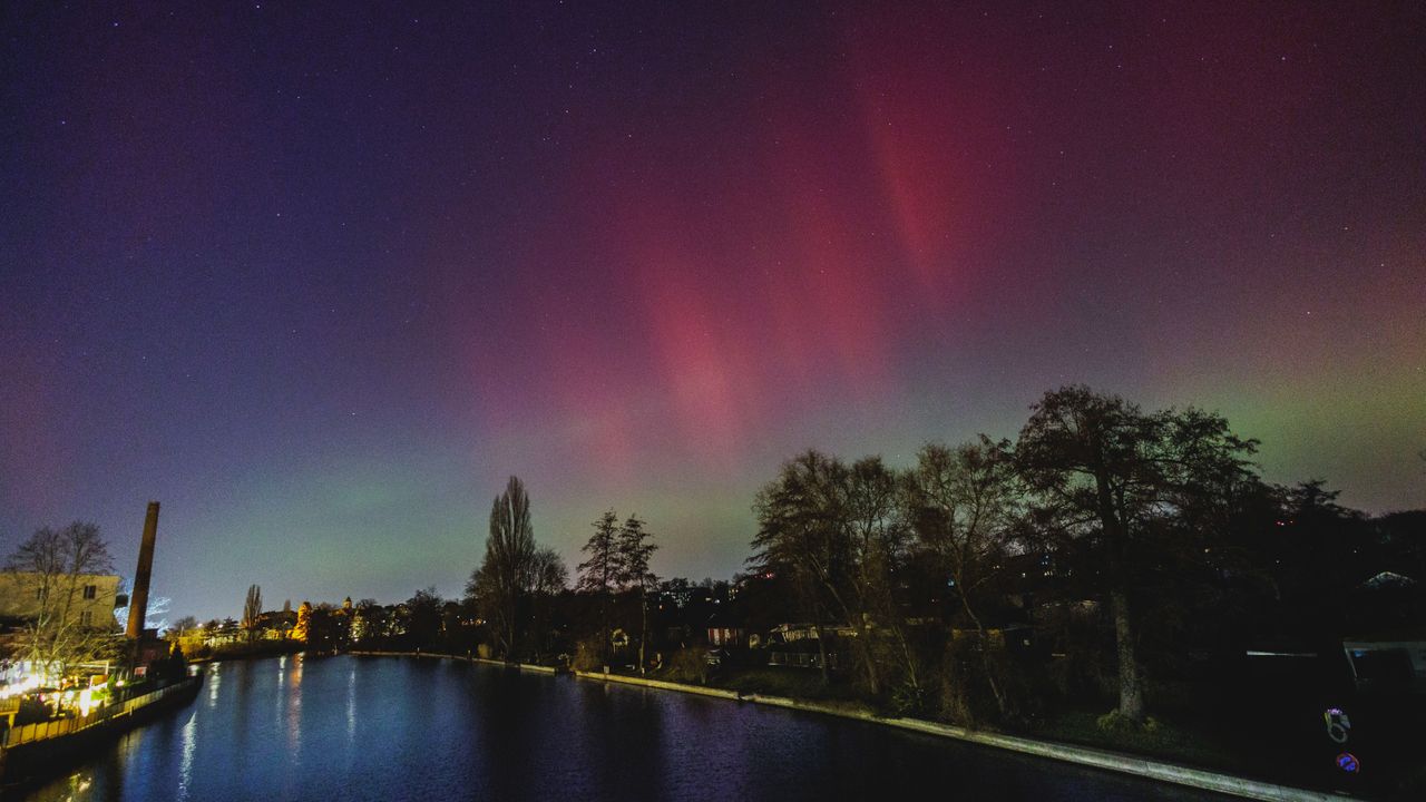 Auroras in the skies over a German river