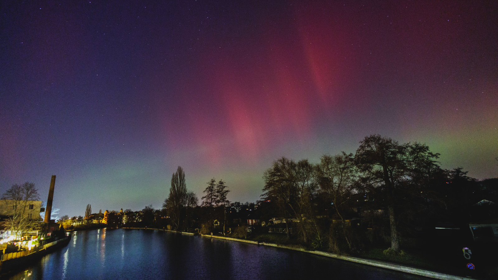 Auroras in the skies over a German river