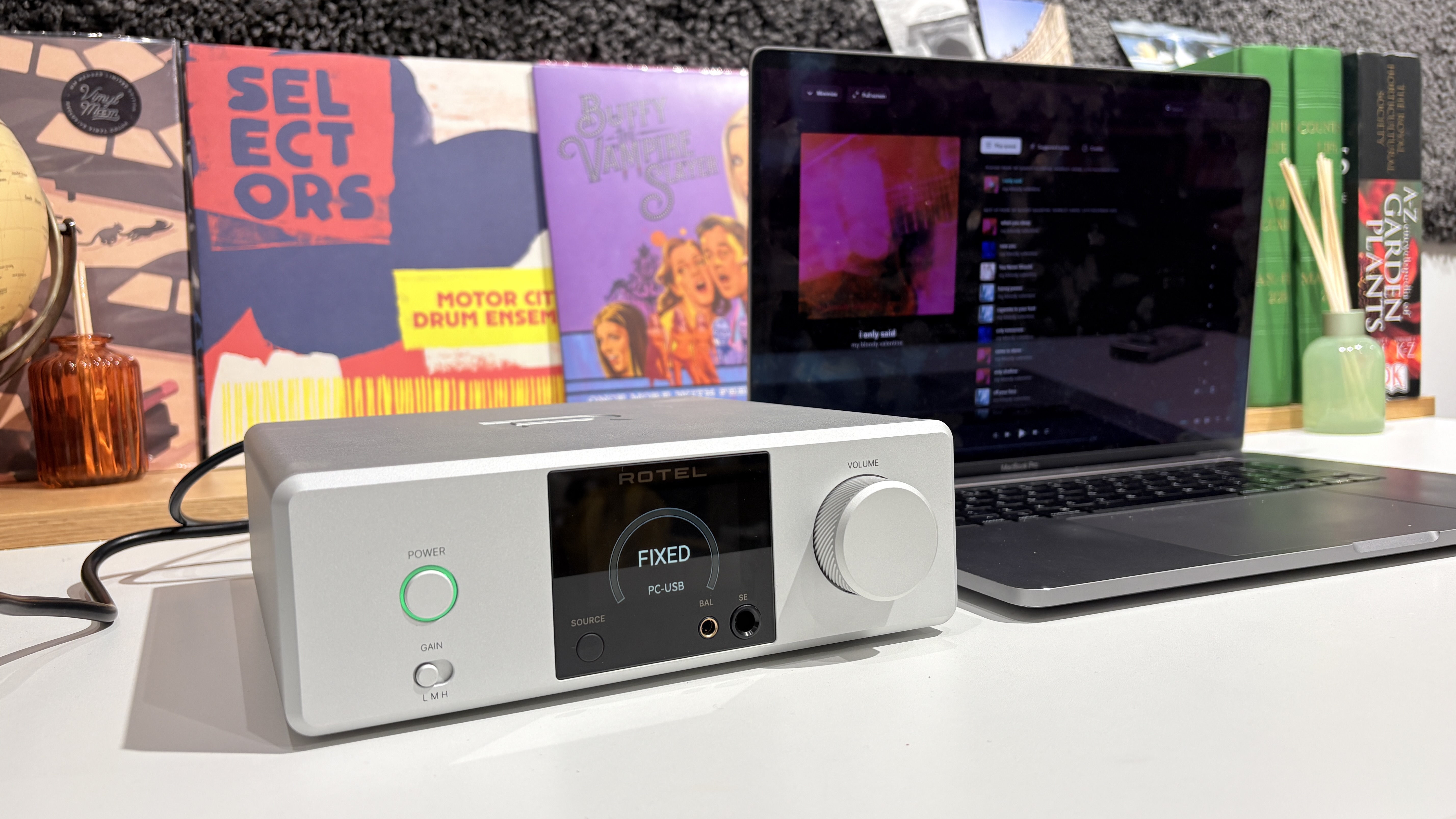 Rotel DX-3 on white desk next to MacBook laptop