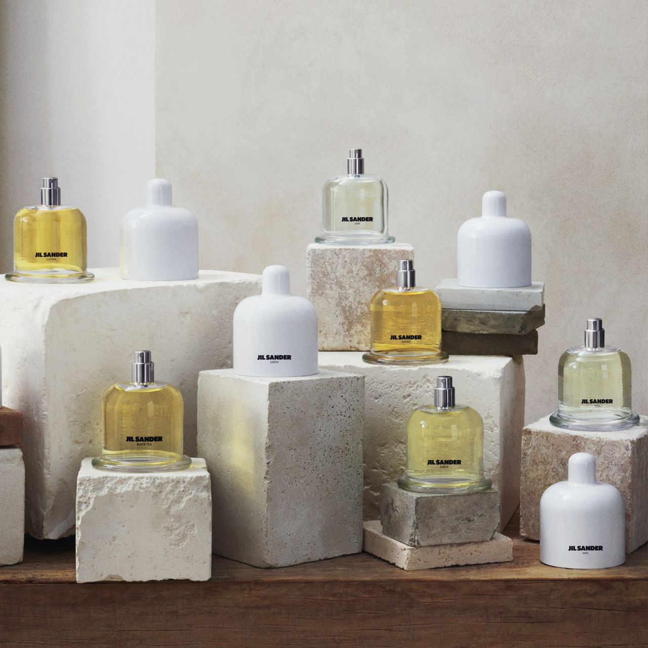 The new Jil Sander Olfactory Series 1 collection is pictured sitting o various marble and stone boxes