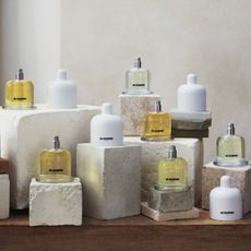 The new Jil Sander Olfactory Series 1 collection is pictured sitting o various marble and stone boxes