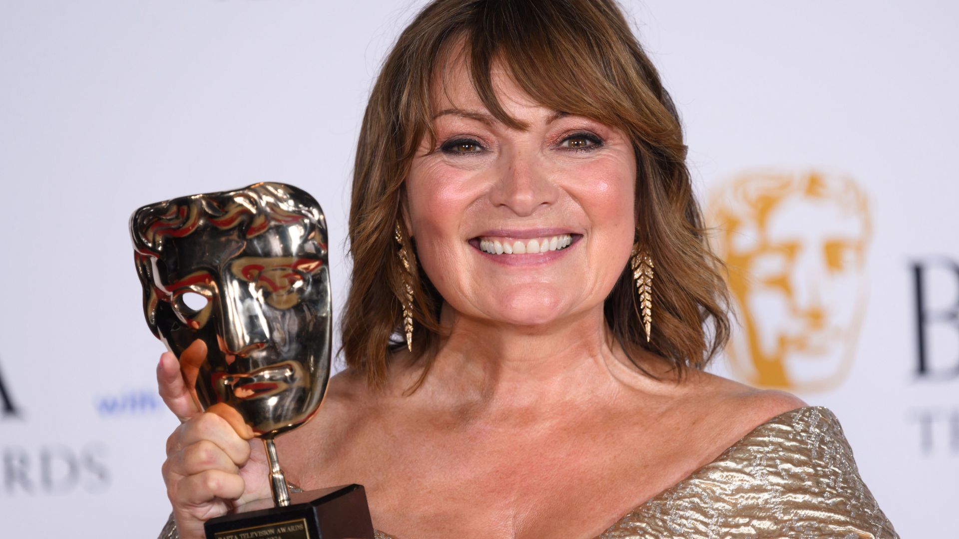 Lorraine Kelly at the 2024 BAFTAs, posing with her award